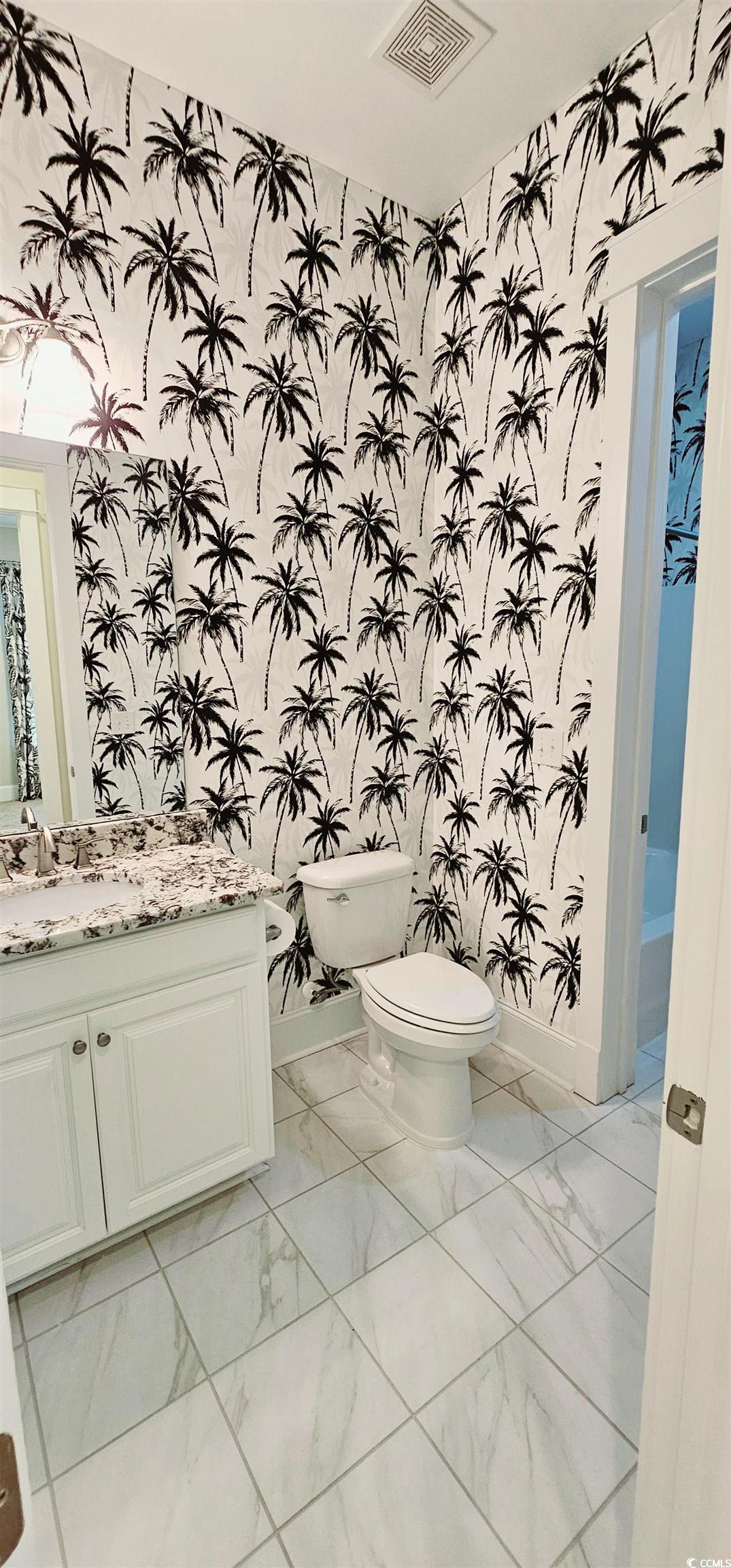 7710 Monarch Drive Myrtle Beach, SC 29572 - Photo 14 of 40 Half bathroom featuring wallpapered walls, visible