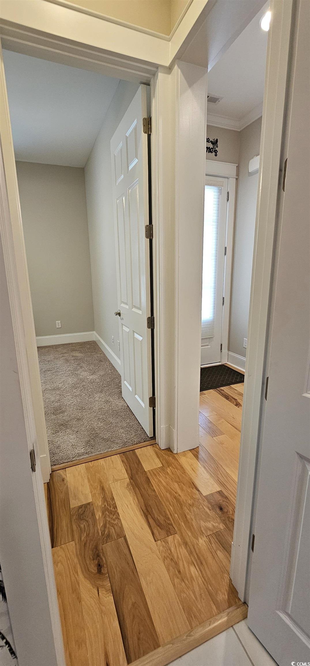 7710 Monarch Drive Myrtle Beach, SC 29572 - Photo 16 of 40 Hall featuring light wood finished floors, baseboa