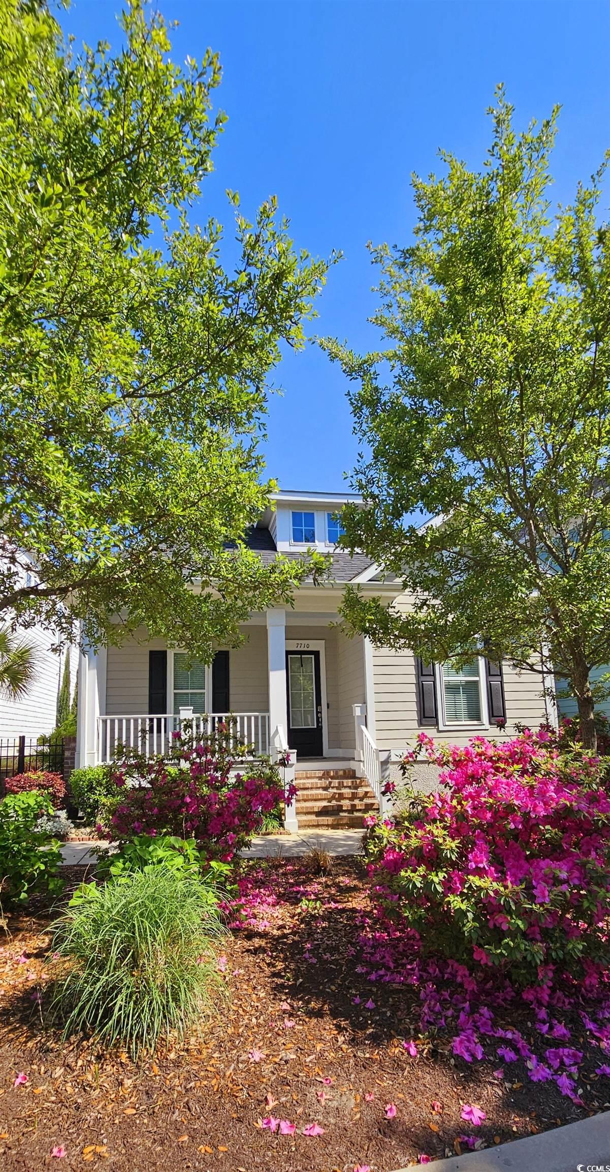 7710 Monarch Drive Myrtle Beach, SC 29572 - Photo 2 of 40 View of front of home with covered porch