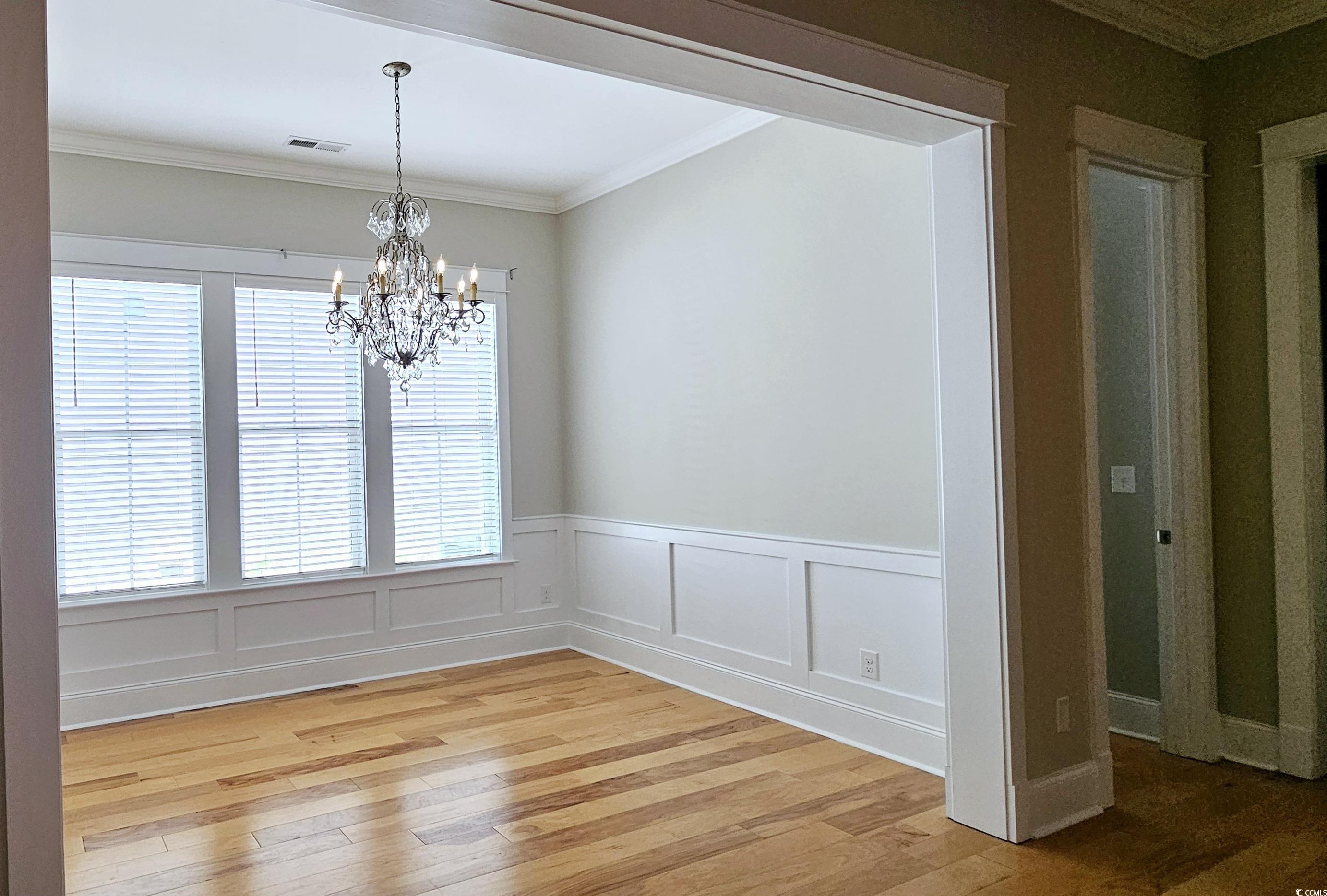 7710 Monarch Drive Myrtle Beach, SC 29572 - Photo 23 of 40 Unfurnished dining area featuring a chandelier, li