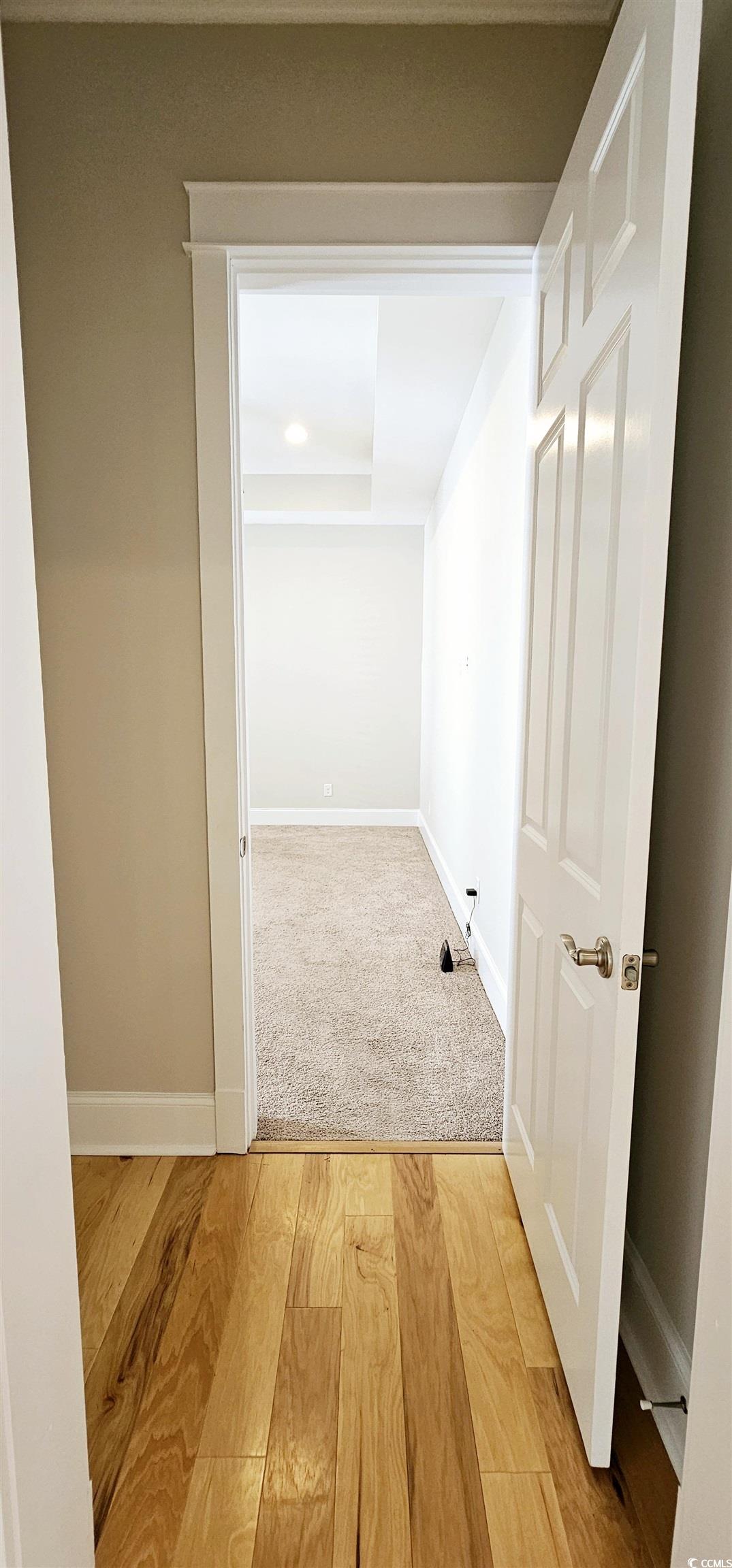 7710 Monarch Drive Myrtle Beach, SC 29572 - Photo 29 of 40 Hallway featuring light wood-type flooring and bas