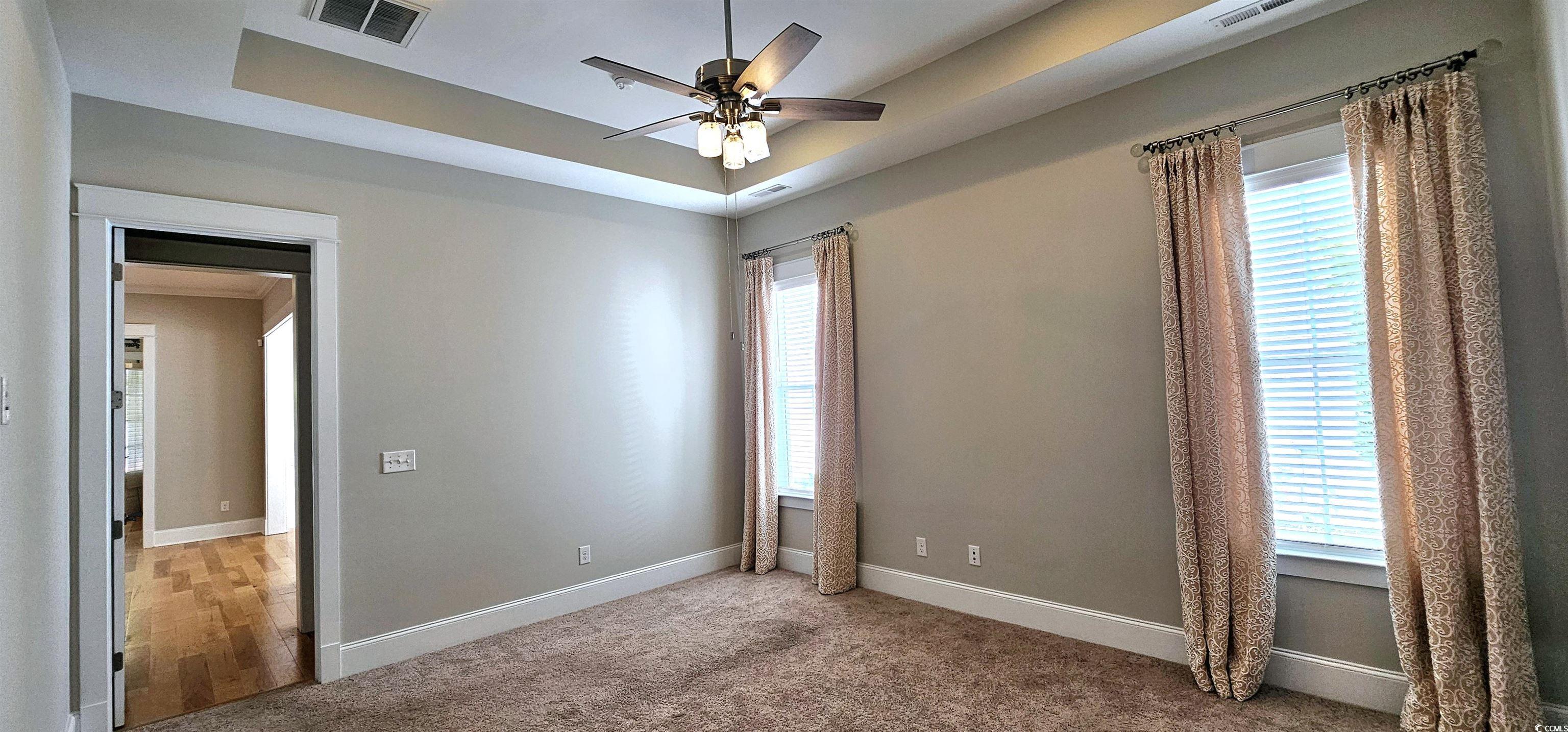 7710 Monarch Drive Myrtle Beach, SC 29572 - Photo 31 of 40 Spare room featuring ceiling fan, baseboards, visi