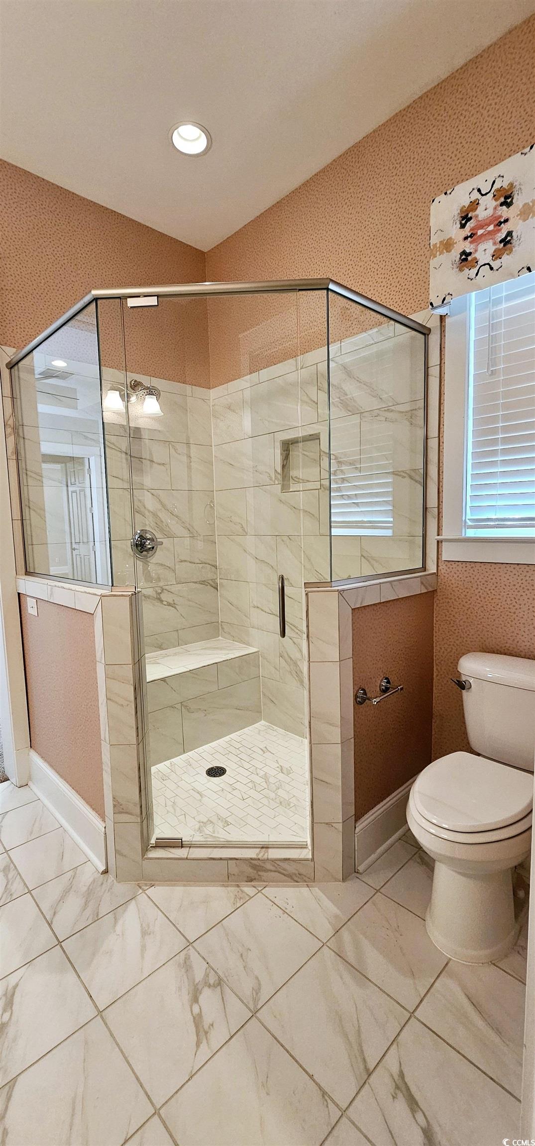 7710 Monarch Drive Myrtle Beach, SC 29572 - Photo 34 of 40 Bathroom with marble finish floor, toilet, a stall