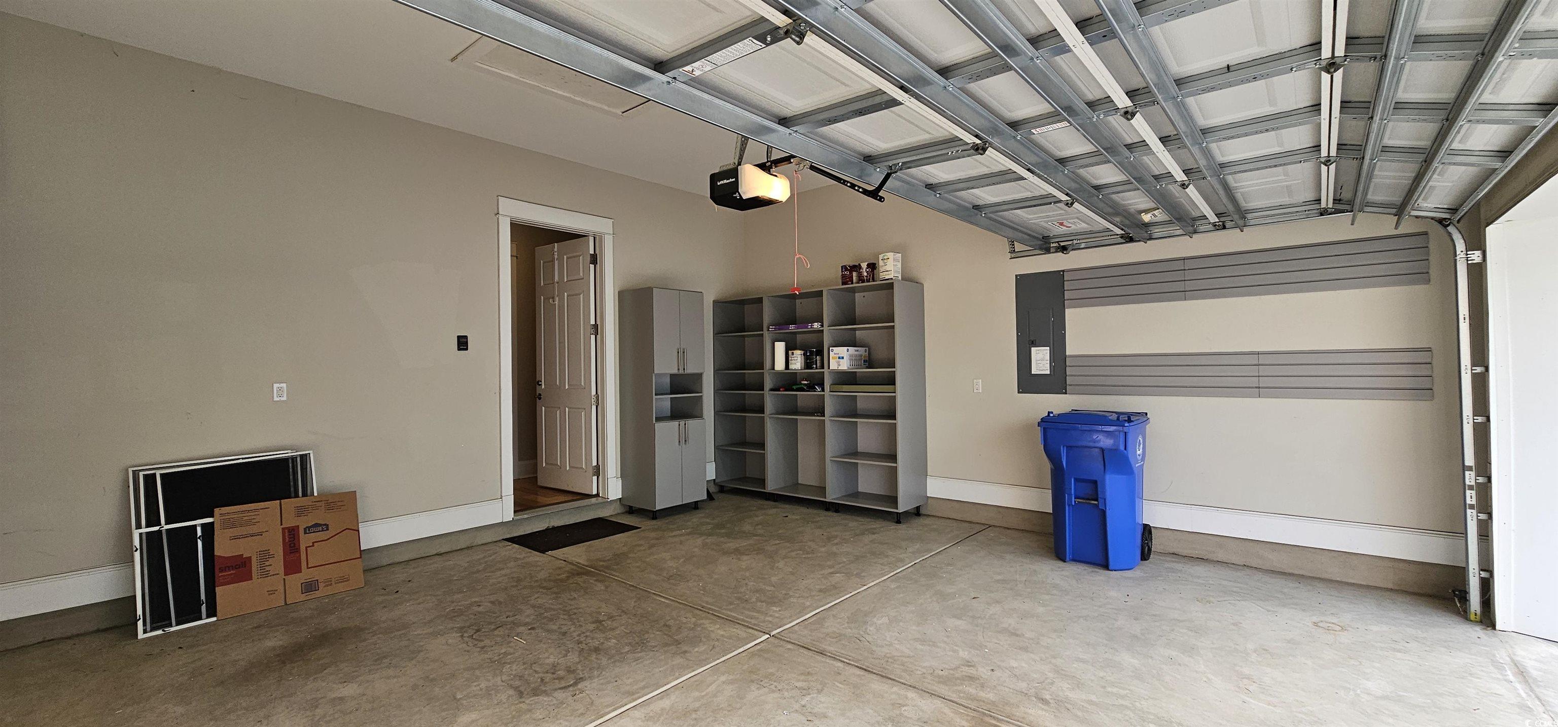 7710 Monarch Drive Myrtle Beach, SC 29572 - Photo 38 of 40 Garage featuring a garage door opener, electric pa