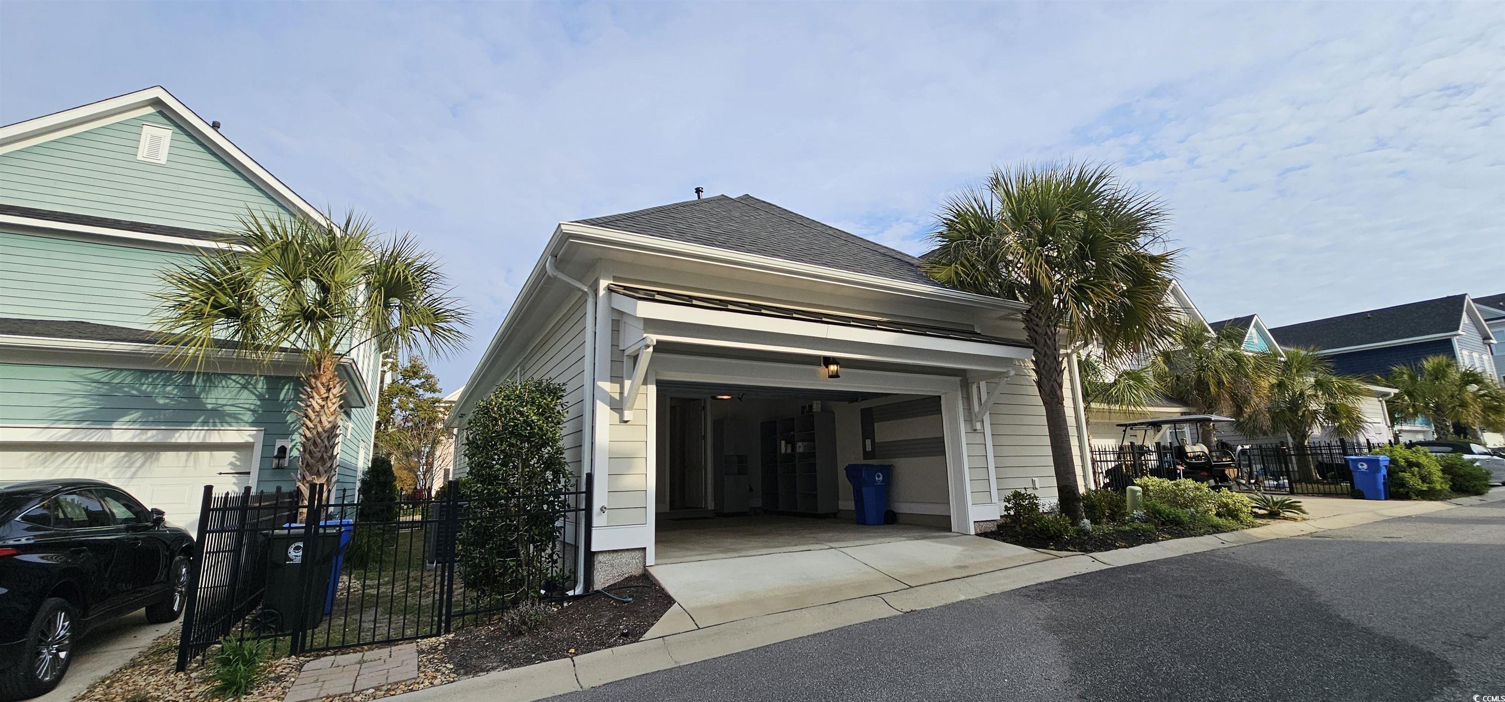 7710 Monarch Drive Myrtle Beach, SC 29572 - Photo 39 of 40 Exterior space featuring fence and driveway