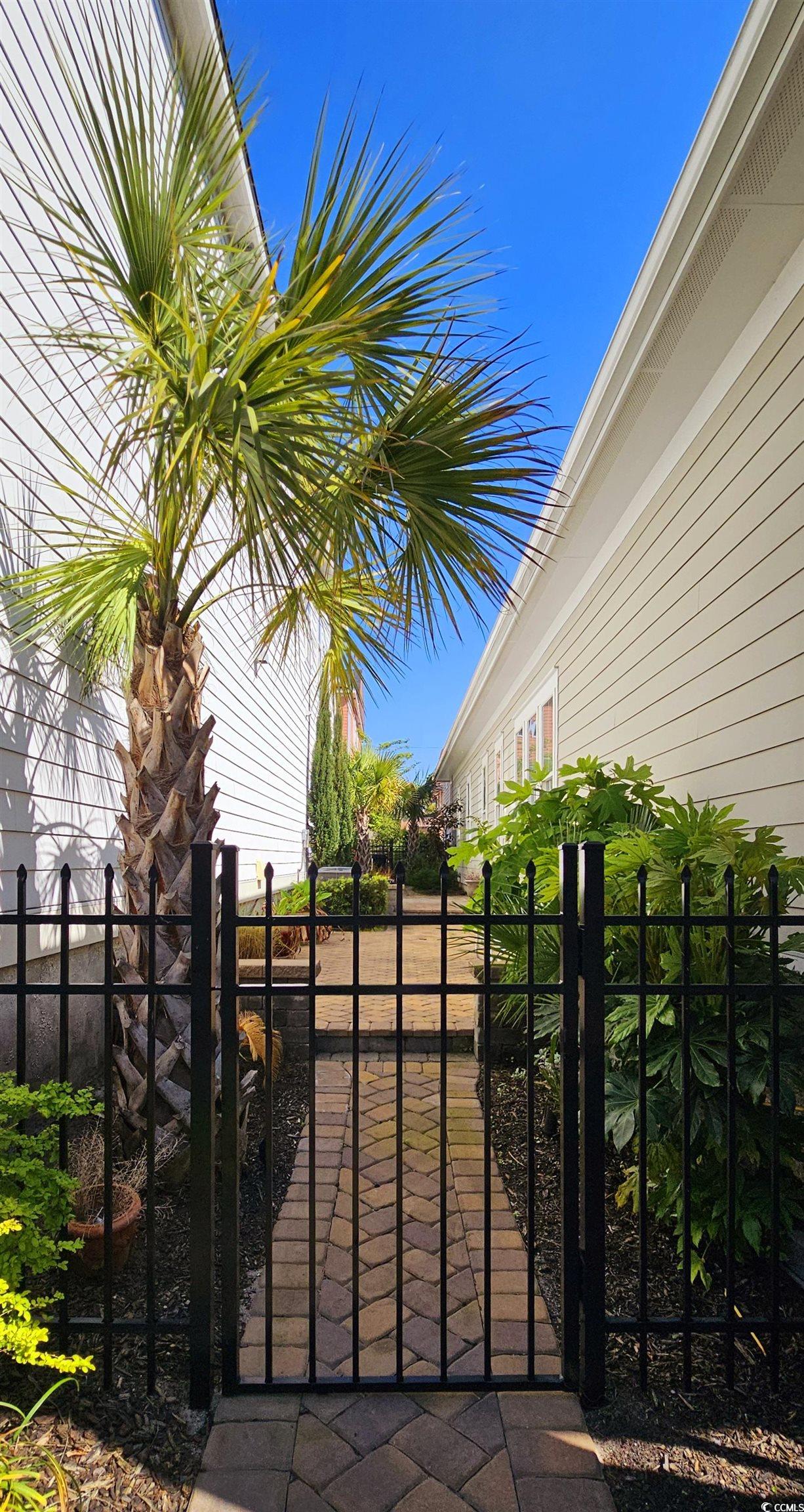 7710 Monarch Drive Myrtle Beach, SC 29572 - Photo 5 of 40 View of gate featuring fence