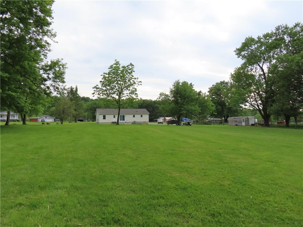 887 Mud Pike Road Smithfield, PA 15478 - Photo 8 of 36 a green field with trees in the background