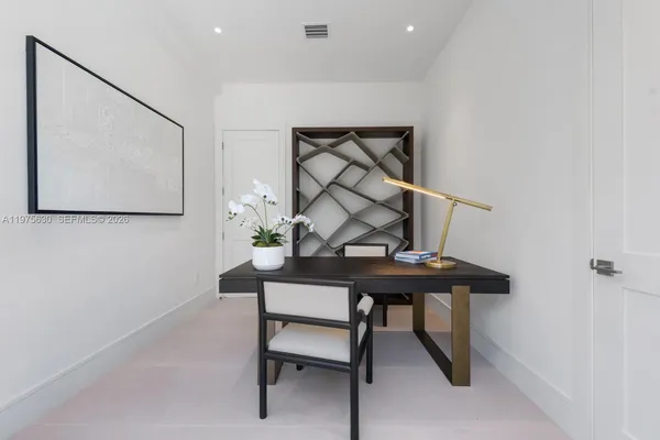 a view of a workspace with furniture