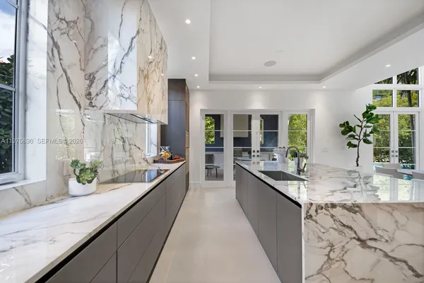 a large kitchen with granite countertop lots of counter top space