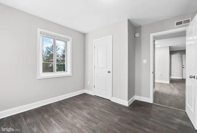 a bathroom with a sink toilet vanity and shower