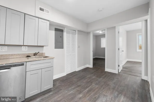 a kitchen with a sink stove and refrigerator