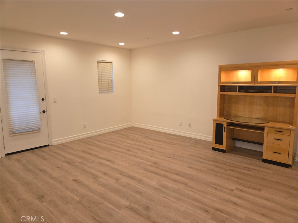 14 Red Leaf Lane Ladera Ranch, CA 92694 - Photo 3 of 14 an empty room with wooden floor and bathroom