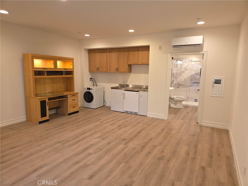 14 Red Leaf Lane Ladera Ranch, CA 92694 - Photo 4 of 14 a room with stainless steel appliances wooden floors and kitchen view