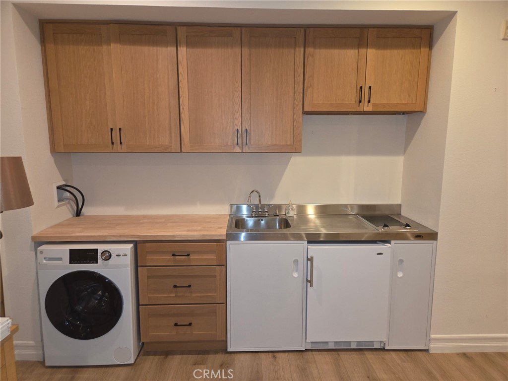 14 Red Leaf Lane Ladera Ranch, CA 92694 - Photo 6 of 14 a kitchen with granite countertop a sink a stove and cabinets