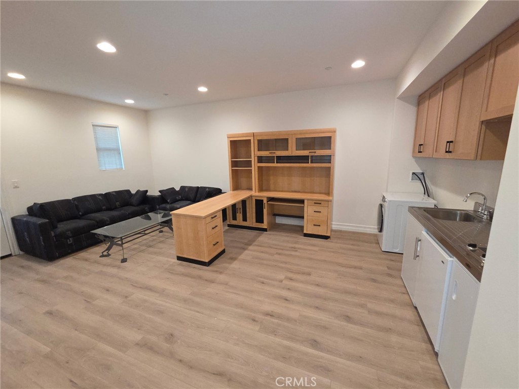 14 Red Leaf Lane Ladera Ranch, CA 92694 - Photo 9 of 14 a kitchen with stainless steel appliances kitchen island granite countertop a sink and cabinets