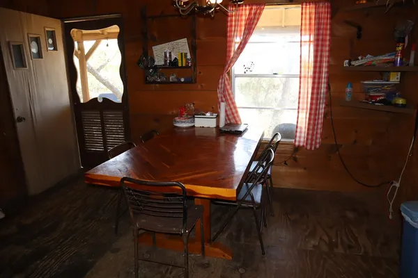 a view of a dining room with furniture and window