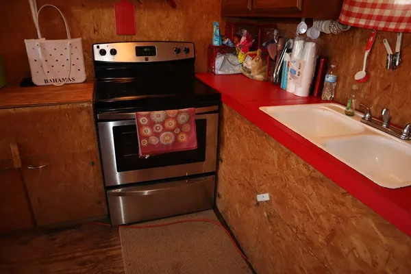 a view of a field with a tree in the background