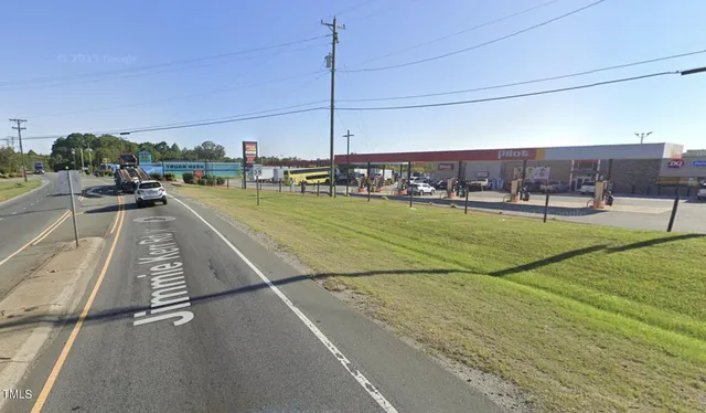 a view of a swimming pool with chairs