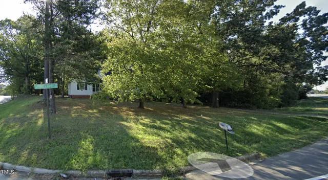 a view of a field with of trees
