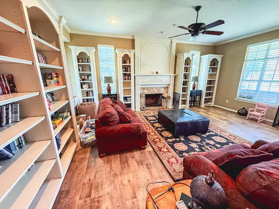 a living room with furniture a rug and a chandelier
