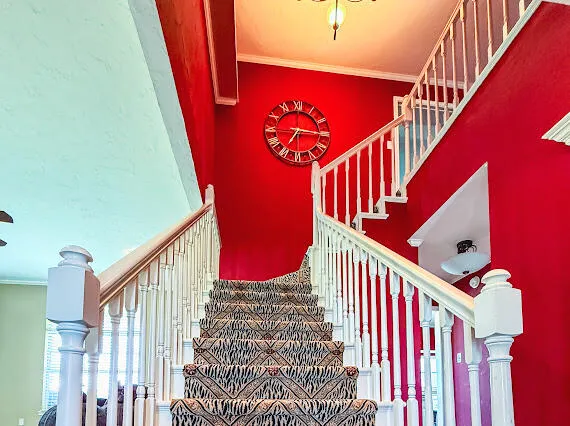 a view of a patio with a table and chairs