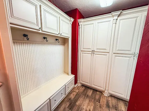 a bathroom with a toilet and a mirror