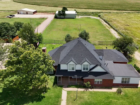 an aerial view of a house with swimming pool