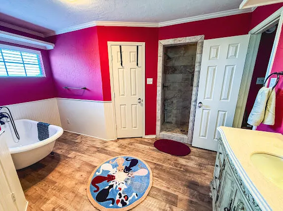 a bedroom with furniture and a chandelier