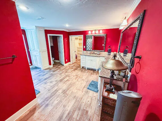 a view of a kitchen with furniture and a refrigerator