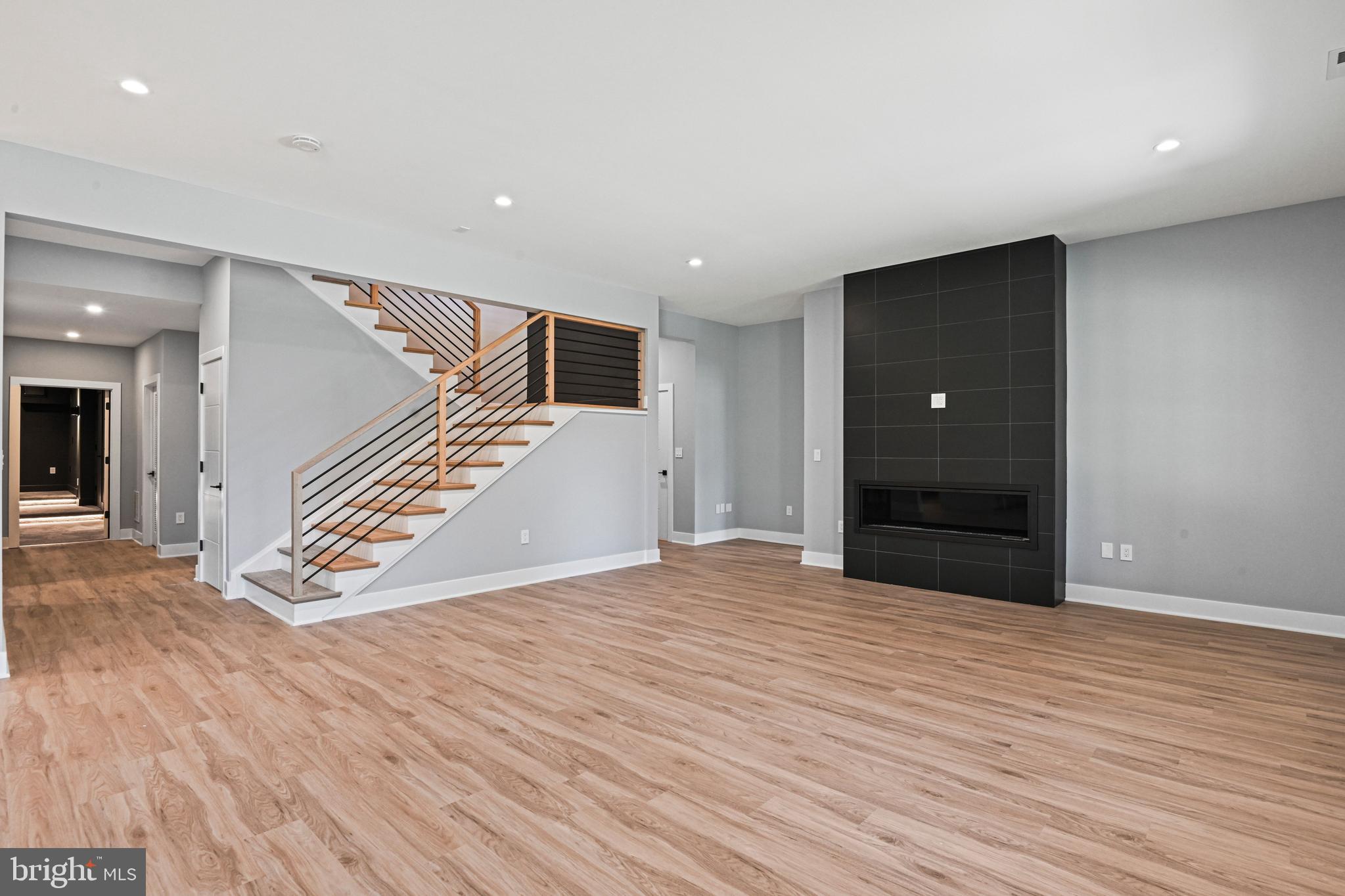 1052 Balls Hill Road McLean, VA 22101 - Photo 46 of 64 a view of an empty room with wooden floor and stairs