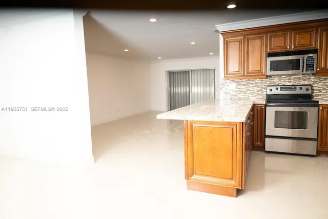 a view of a kitchen with a sink and a microwave