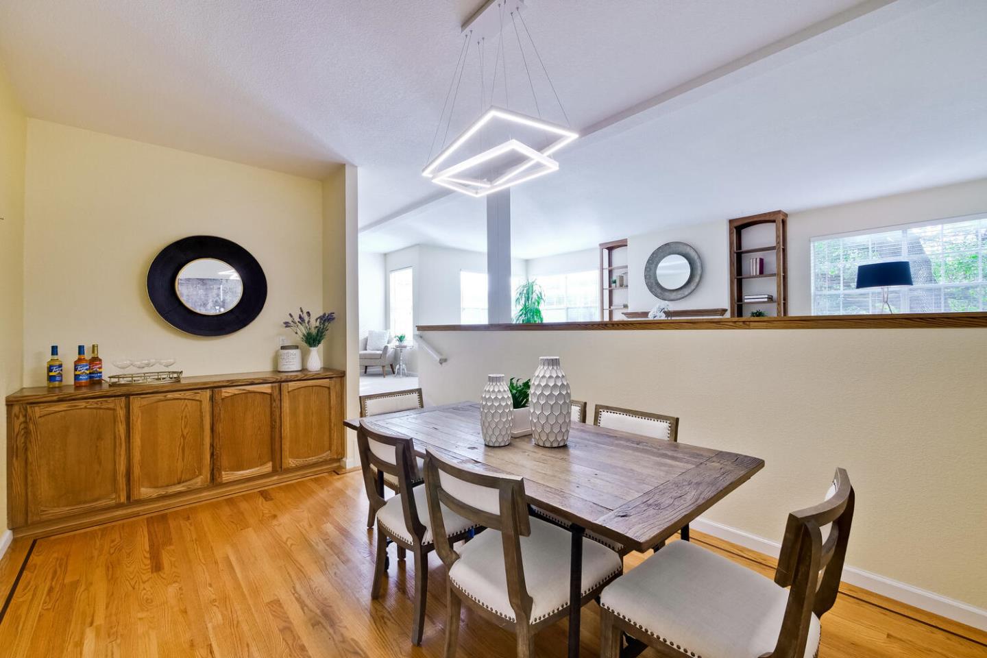 44 Holmes Drive San Jose, CA 95127 - Photo 11 of 48 a view of a dining room with furniture and a mirror