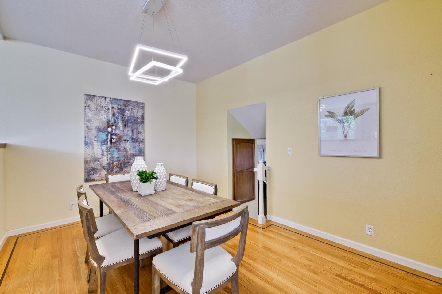 44 Holmes Drive San Jose, CA 95127 - Photo 12 of 48 a view of a dining room with furniture and wooden floor
