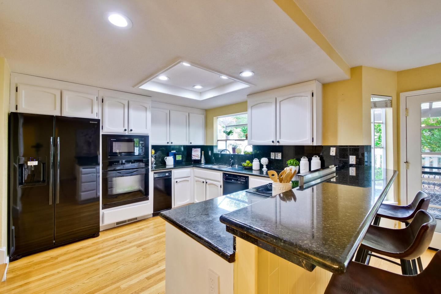 44 Holmes Drive San Jose, CA 95127 - Photo 14 of 48 a kitchen with stainless steel appliances granite countertop a stove refrigerator and cabinets