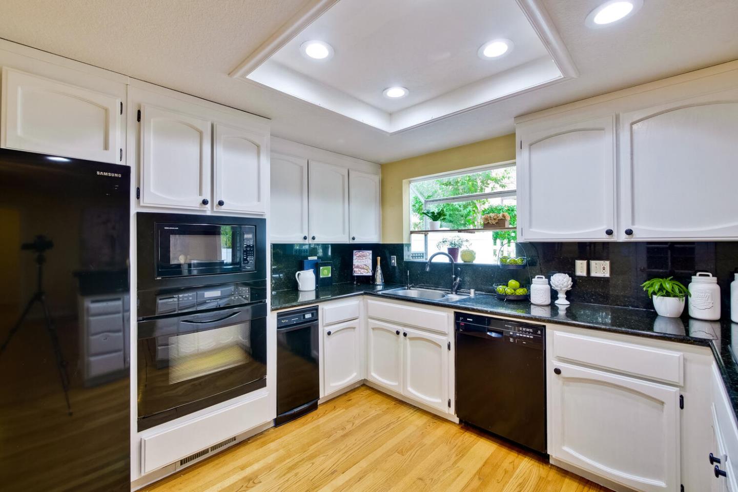 44 Holmes Drive San Jose, CA 95127 - Photo 15 of 48 a kitchen with a refrigerator sink and cabinets