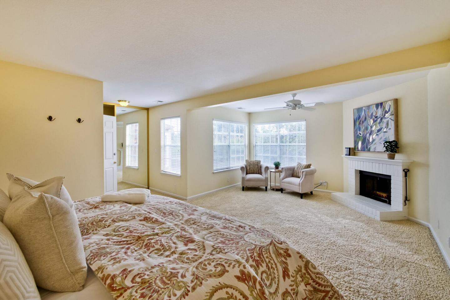 44 Holmes Drive San Jose, CA 95127 - Photo 27 of 48 a spacious bedroom with a bed and glass window