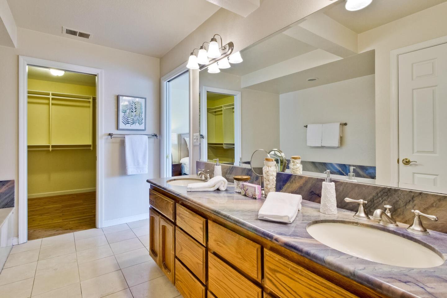 44 Holmes Drive San Jose, CA 95127 - Photo 31 of 48 a bathroom with a granite countertop sink and a mirror