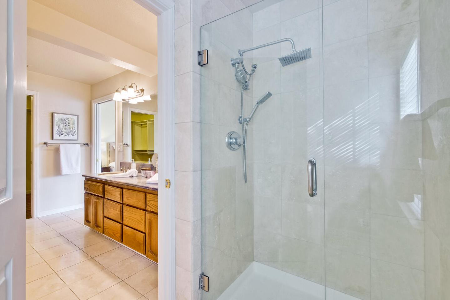 44 Holmes Drive San Jose, CA 95127 - Photo 32 of 48 a bathroom with a sink a mirror and a shower