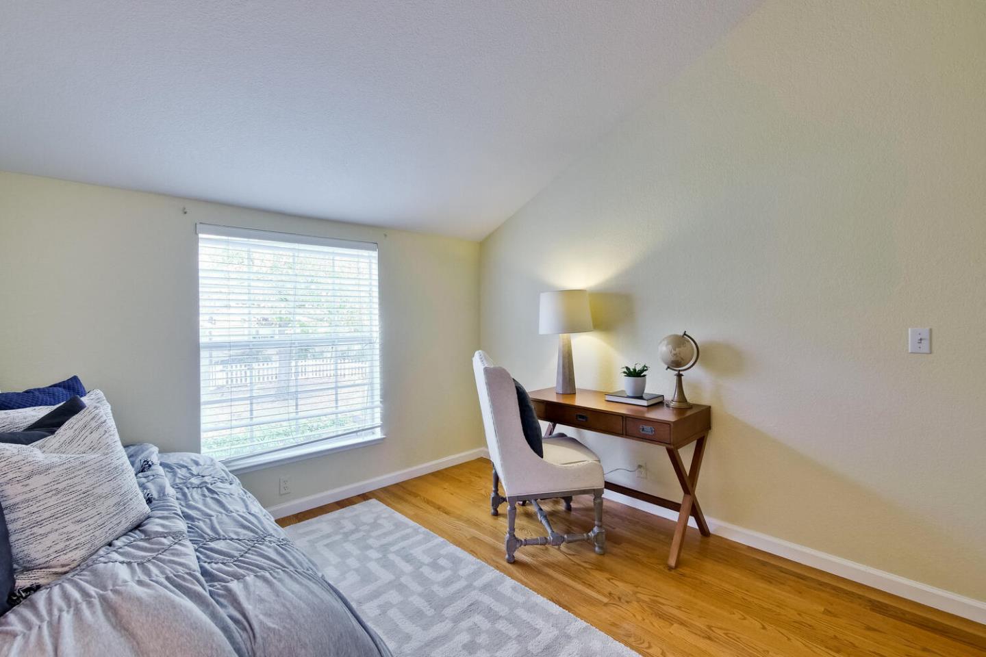 44 Holmes Drive San Jose, CA 95127 - Photo 35 of 48 a bedroom with a bed a chair and a window