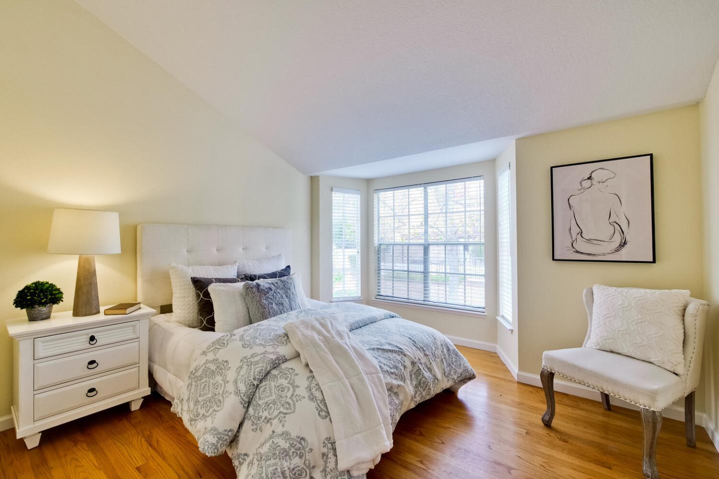 44 Holmes Drive San Jose, CA 95127 - Photo 37 of 48 a spacious bedroom with a bed and a couch