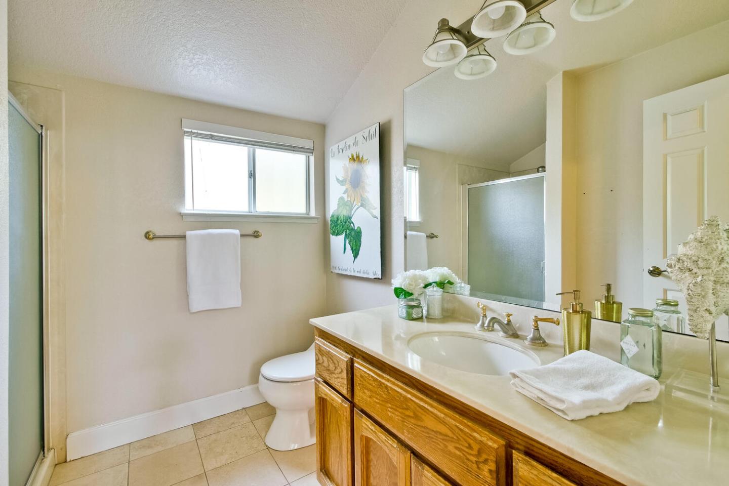 44 Holmes Drive San Jose, CA 95127 - Photo 40 of 48 a bathroom with a granite countertop sink mirror vanity and toilet