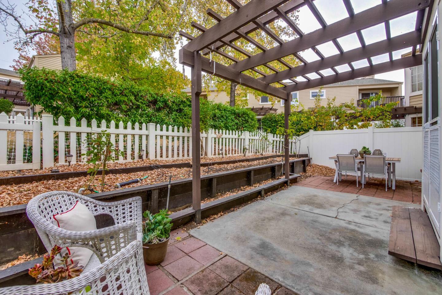 44 Holmes Drive San Jose, CA 95127 - Photo 42 of 48 a backyard of a house with barbeque oven table and chairs