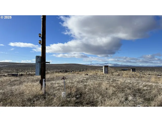 a open area with view of house