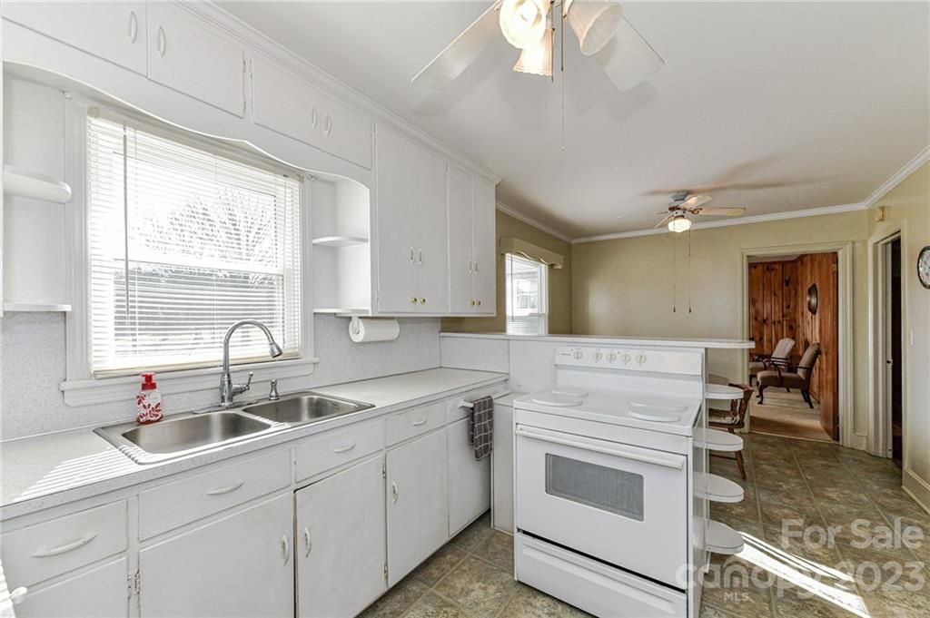 10008 Landsford Road Monroe, NC 28112 - Photo 12 of 32 a kitchen with a sink cabinets and window