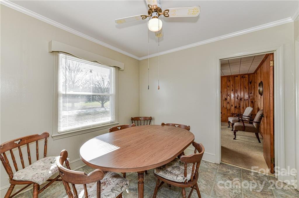 10008 Landsford Road Monroe, NC 28112 - Photo 13 of 32 a view of a dining room with furniture and a chandelier