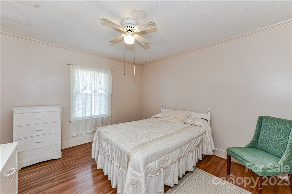 10008 Landsford Road Monroe, NC 28112 - Photo 18 of 32 a bedroom with a bed and a dresser