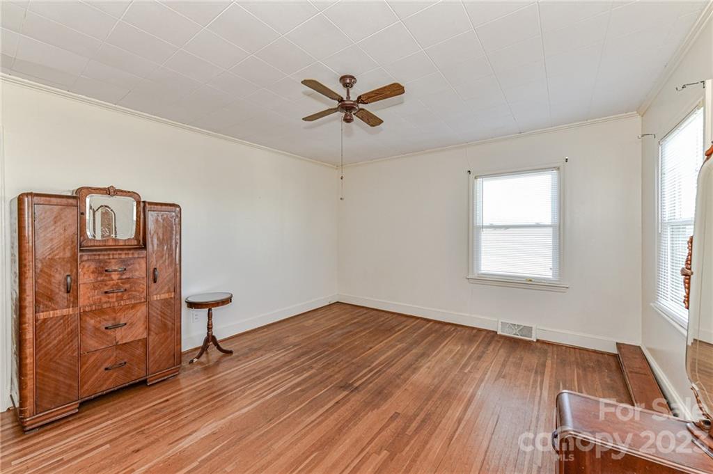 10008 Landsford Road Monroe, NC 28112 - Photo 20 of 32 wooden floor in an empty room with a window