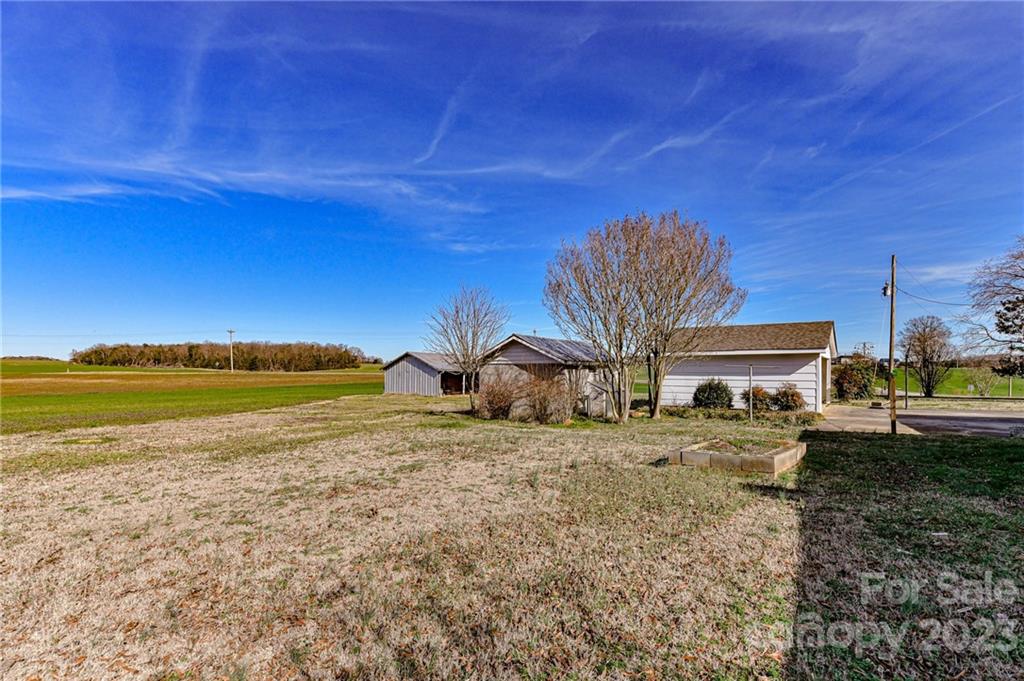 10008 Landsford Road Monroe, NC 28112 - Photo 27 of 32 a view of a house with a yard