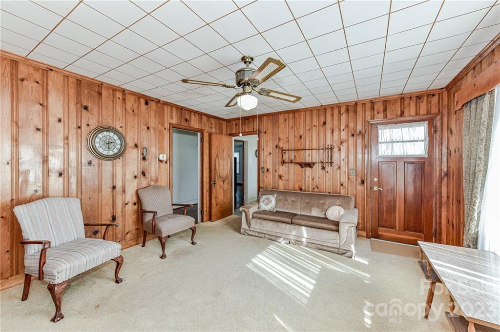 10008 Landsford Road Monroe, NC 28112 - Photo 9 of 32 a spacious bedroom with a bed and a chair