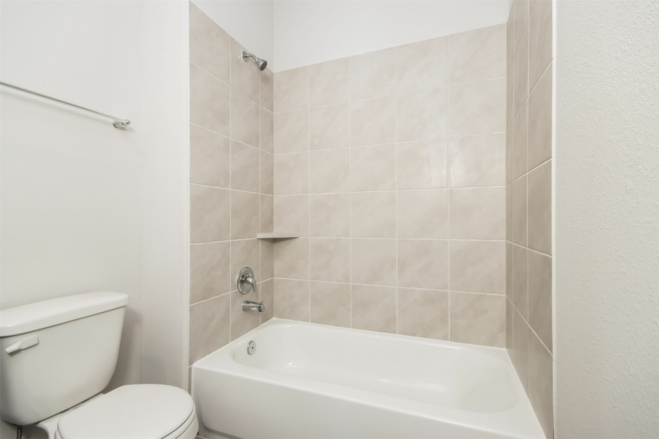 15264 Estrella Road East Houston, TX 77073 - Photo 12 of 14 a white bath tub sitting next to a white toilet